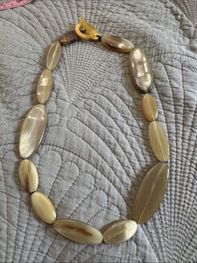 vintage statement necklace featuring chunky, light tan, translucent oval beads